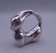 A silver rabbit form baby's rattle. 6 cm wide.