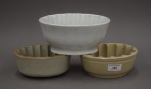 Three pottery jelly moulds. The largest 19 cm long.