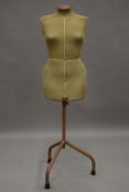 A vintage Singer mannequin. 138 cm high.