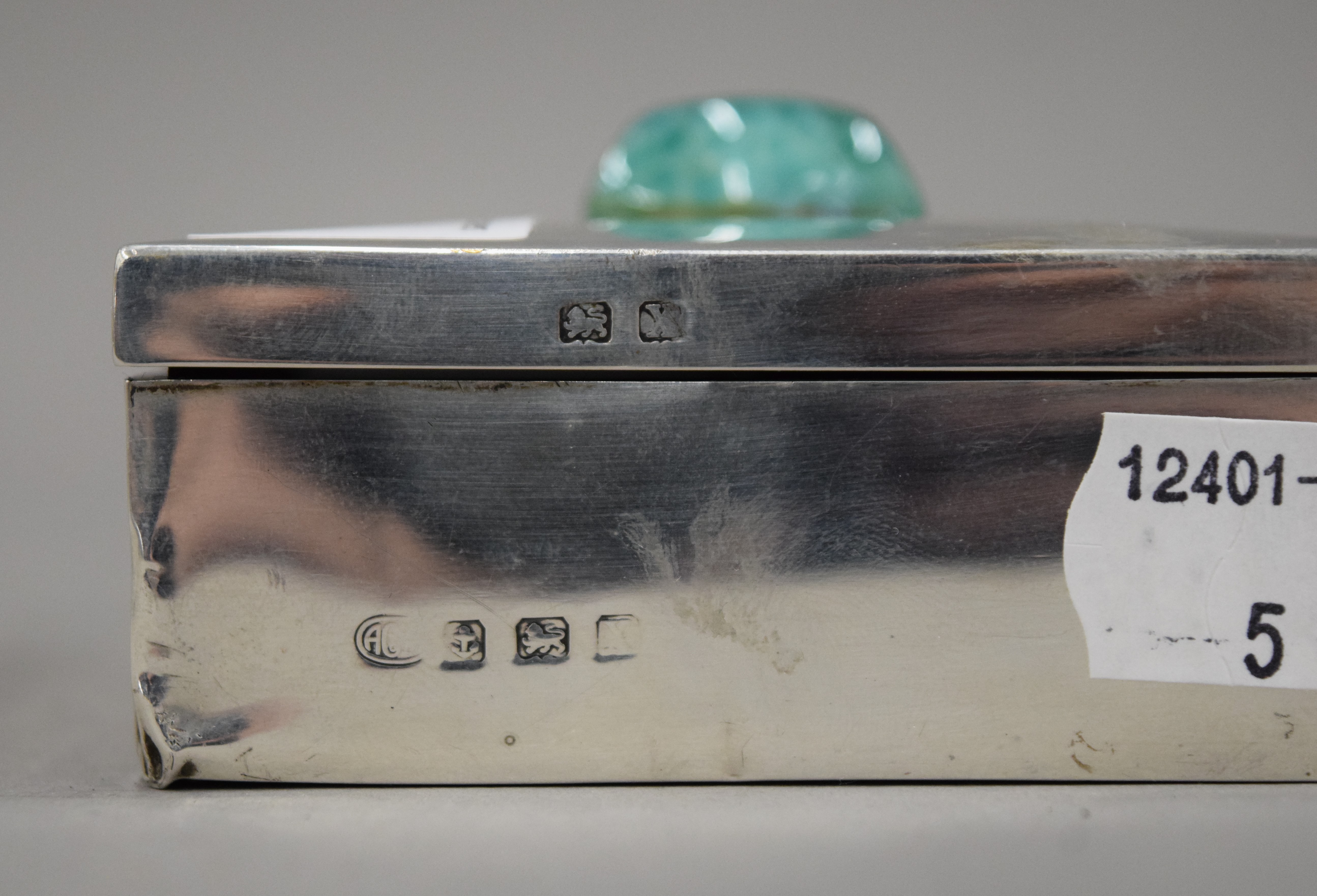 A silver cigarette box with a jade mount. 8 cm wide. - Image 4 of 4