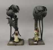 A pair of cold painted bronze table lamps. The largest 34 cm high.
