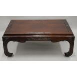 An Eastern hardwood carved coffee table. 120 cm long.