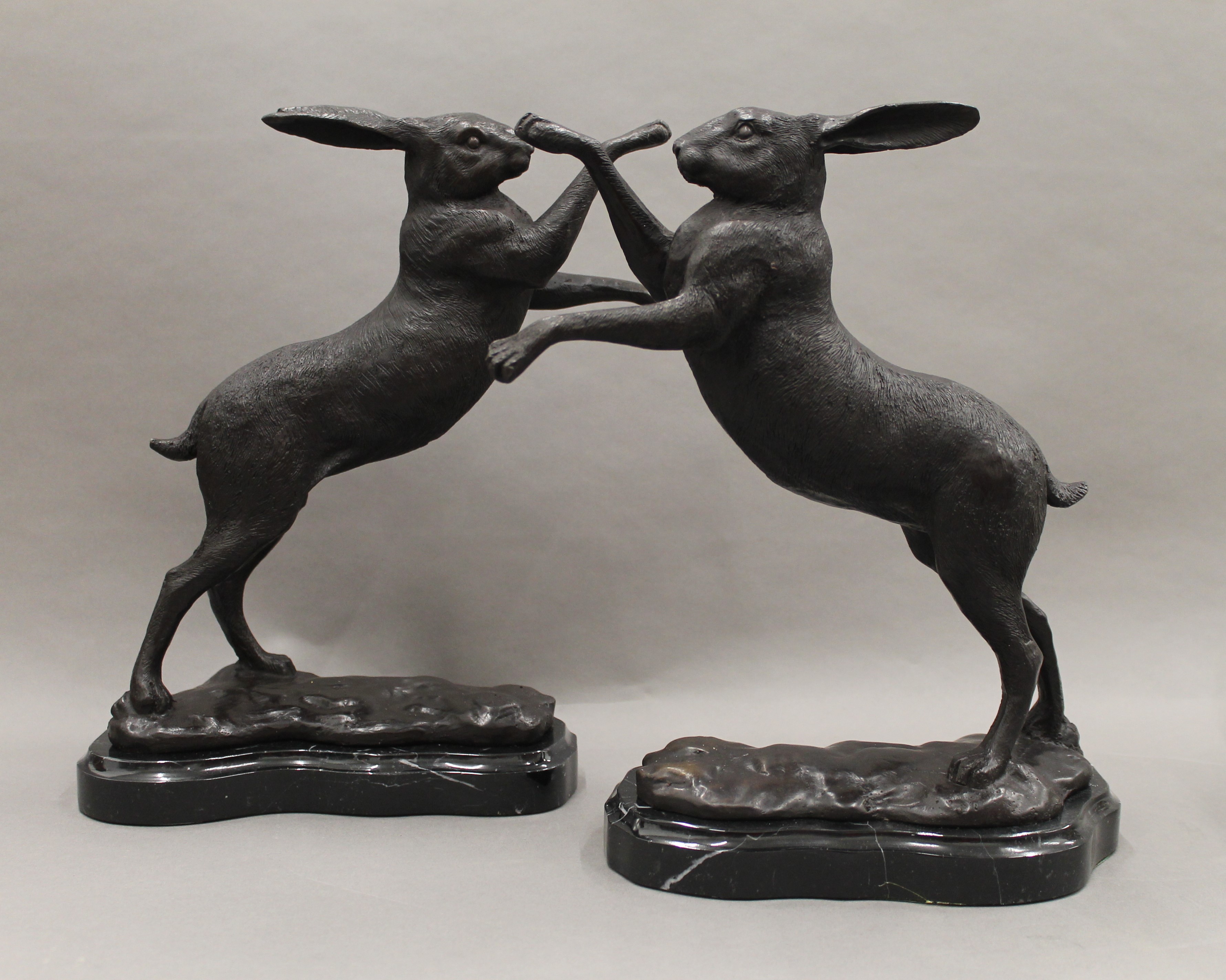 A pair of bronze boxing hares. 29 cm high.
