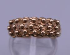 A 9 ct gold ladies keeper's ring. Ring size M/N including sizer. 2.8 grammes.