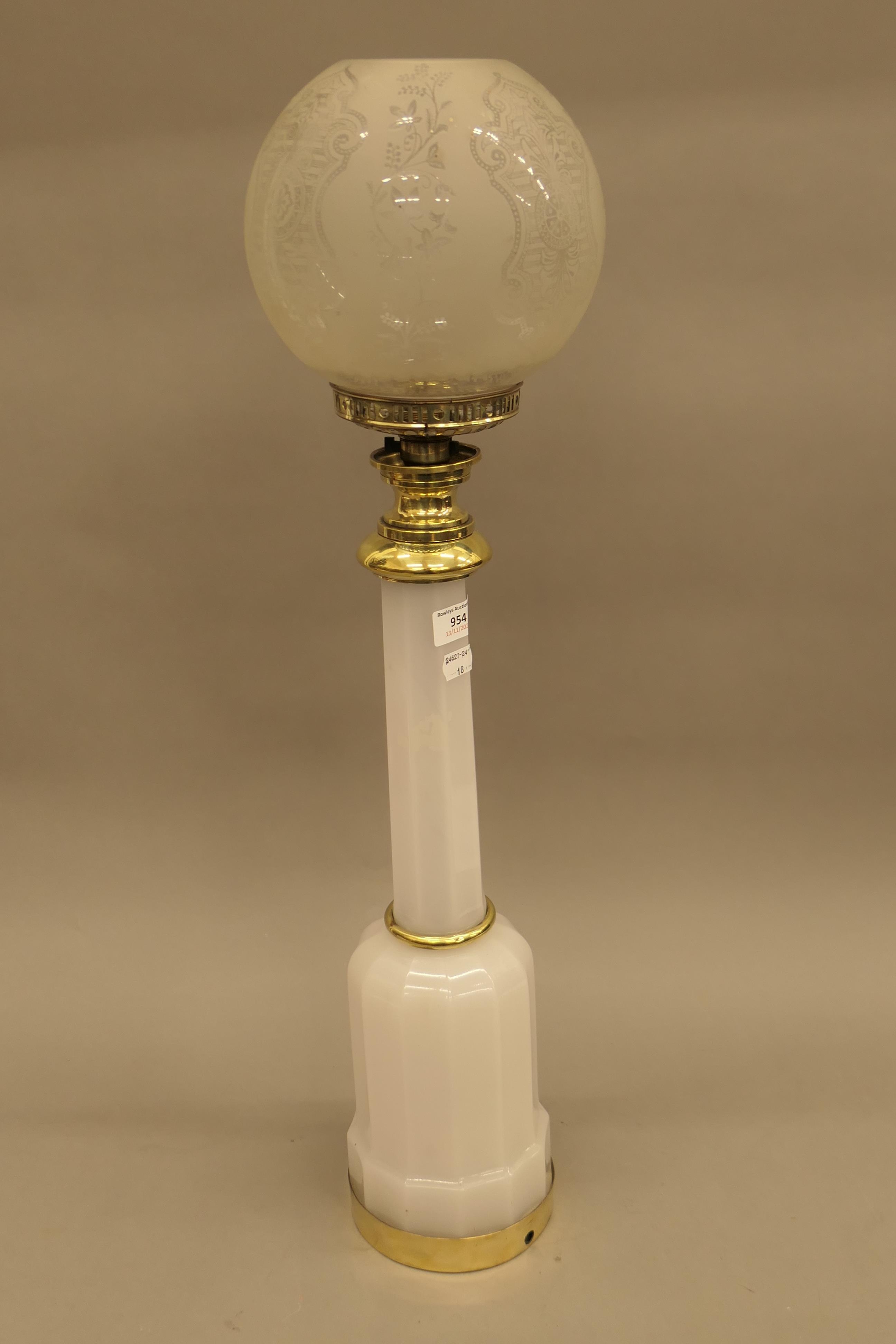 A white milk glass electric lamp. 73 cm high.