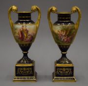 A pair of 19th century Vienna painted porcelain vases. Each 25 cm high.