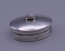 A moonstone set silver snuff box. 3 cm wide.