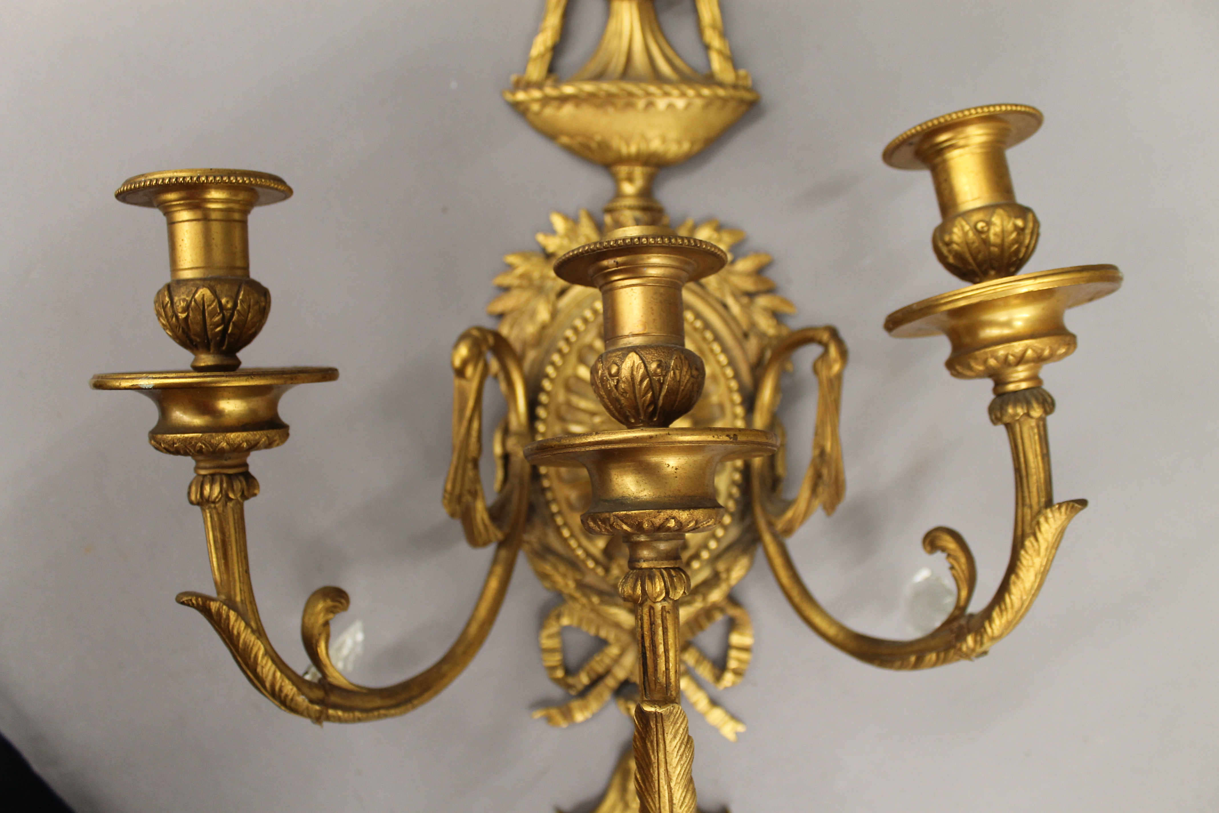 A pair of ormolu three-branch wall lights. 68 cm high. - Image 3 of 5