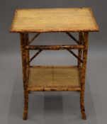 A vintage bamboo two-tier side table. 52.5 cm wide.