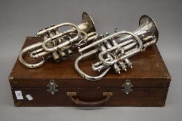 A vintage Hawkes silver plated Clippertone Cornet with shank all valves and slides work;