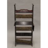 An Arts and Crafts mahogany standing bookrack. 39.5 cm wide.