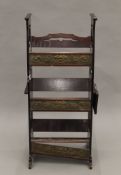 An Arts and Crafts mahogany standing bookrack. 39.5 cm wide.