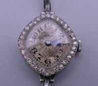 A Tempor diamond set cocktail watch. 2 cm wide.