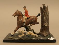 An early 20th century huntsman and hound form table lighter. 15 cm long.