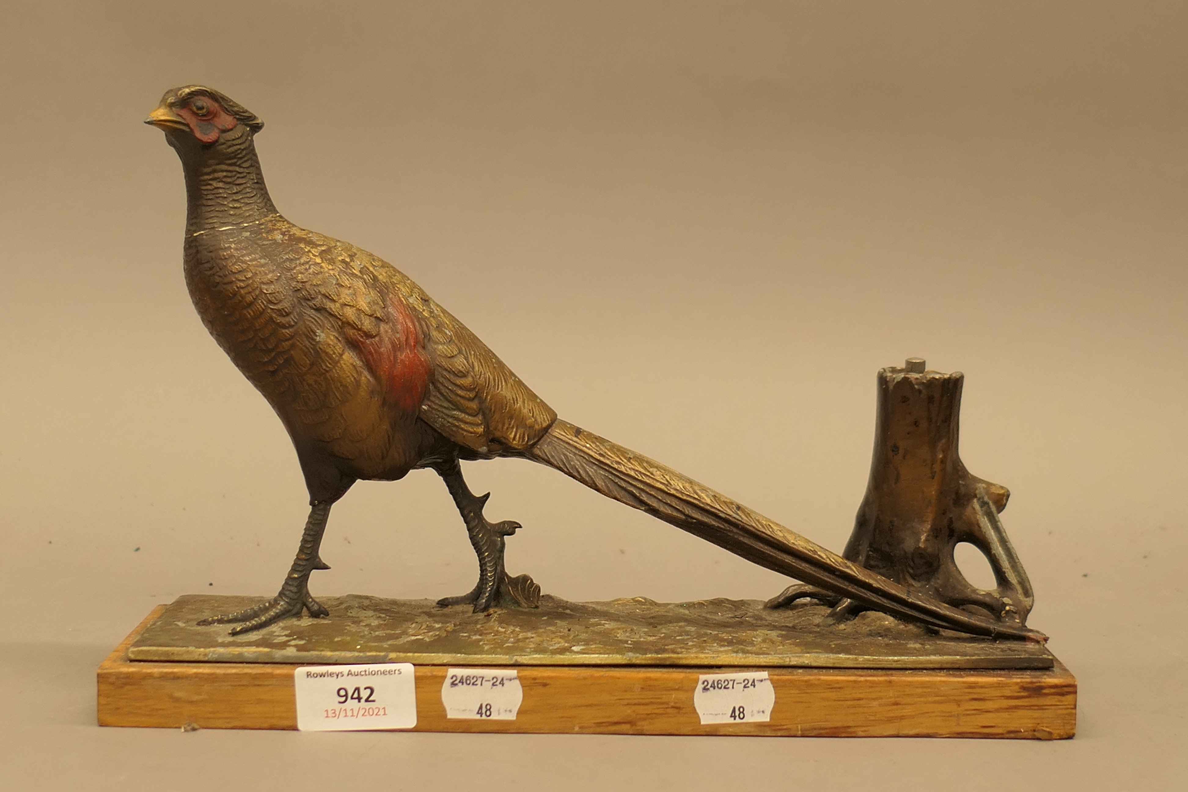 An early 20th century spelter pheasant form table lighter. 31.5 cm long.