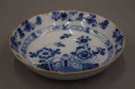 An 18th century Delph blue and white porcelain dish. 22.5 cm diameter.