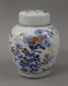 A Chinese porcelain lidded ginger jar. 18 cm high.