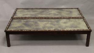 A pair of Chinese mother-of-pearl inlaid mirrored top hardwood coffee tables. 145 cm long.