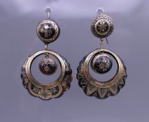 A pair of 19th century gold inlaid tortoiseshell earrings. 5 cm high.