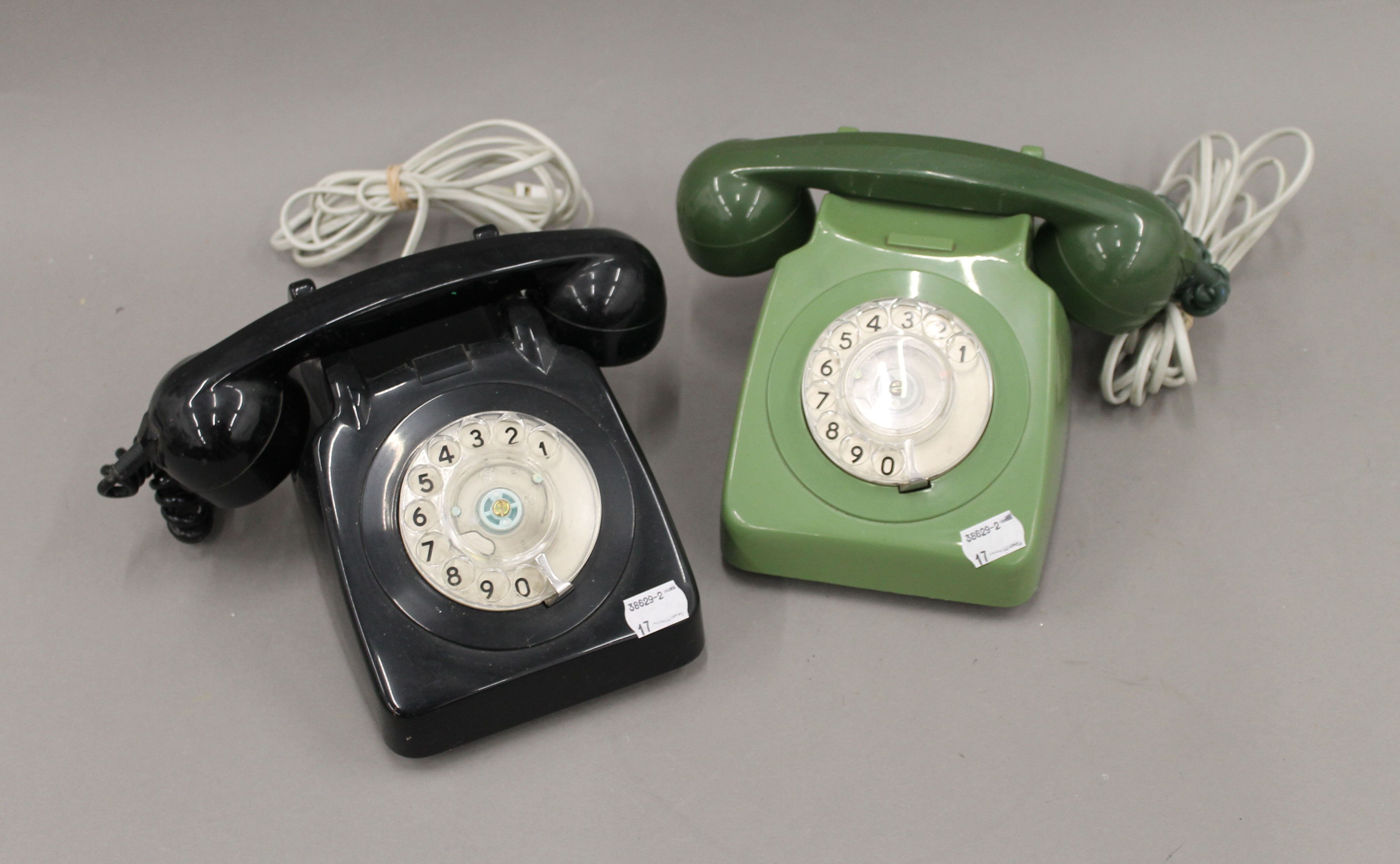 Two vintage telephones.