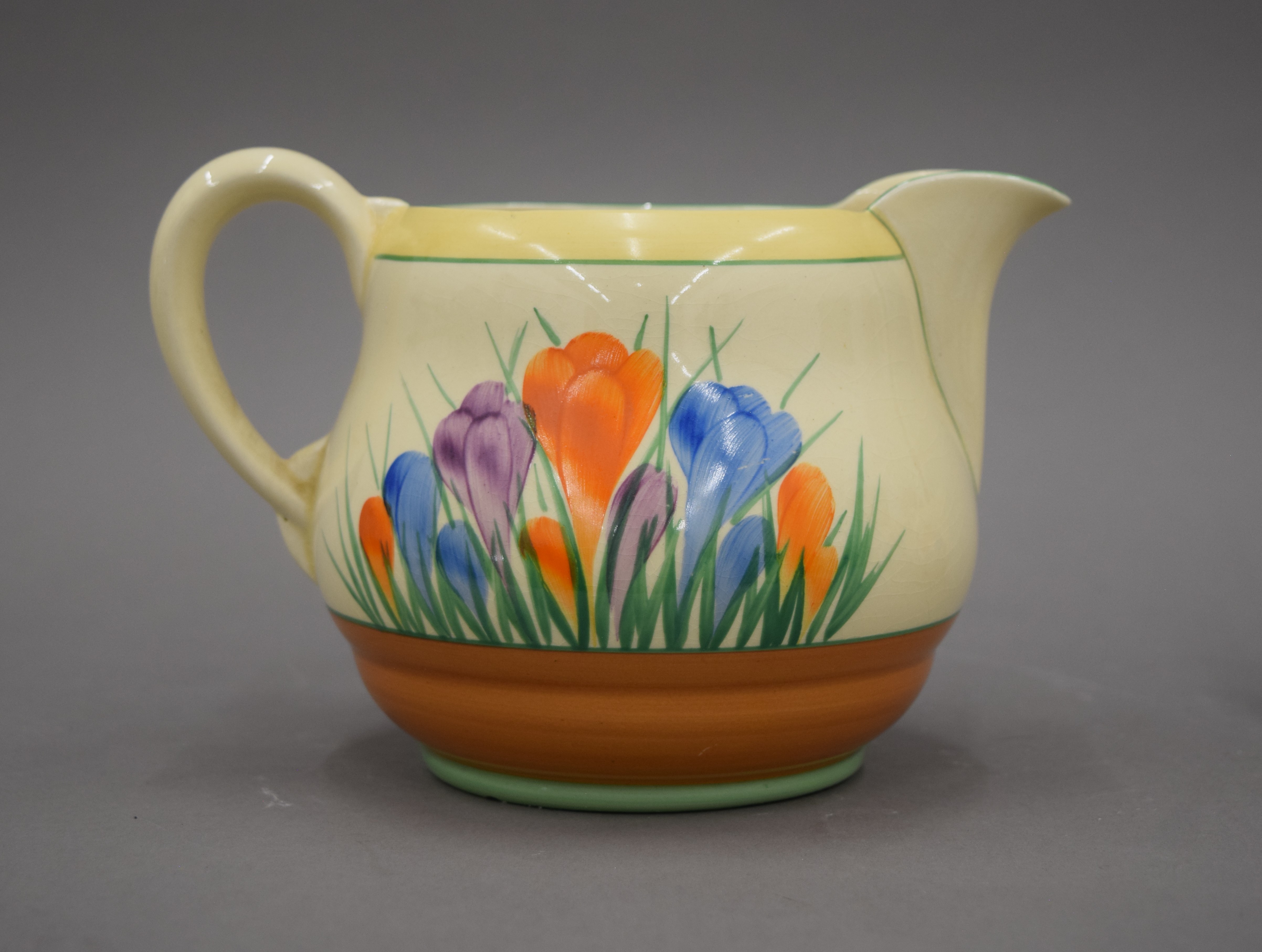 Three Clarice Cliff Crocus pattern jugs. The largest 12.5 cm high. - Image 2 of 8