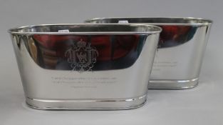 A pair of oval champagne coolers with quotes. 30.5 cm long.