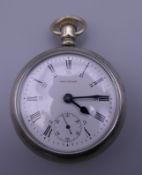 A Waltham pocket watch. 5.5 cm diameter.