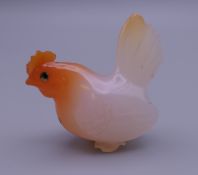 An agate/carnelian carved chicken. 4 cm high.