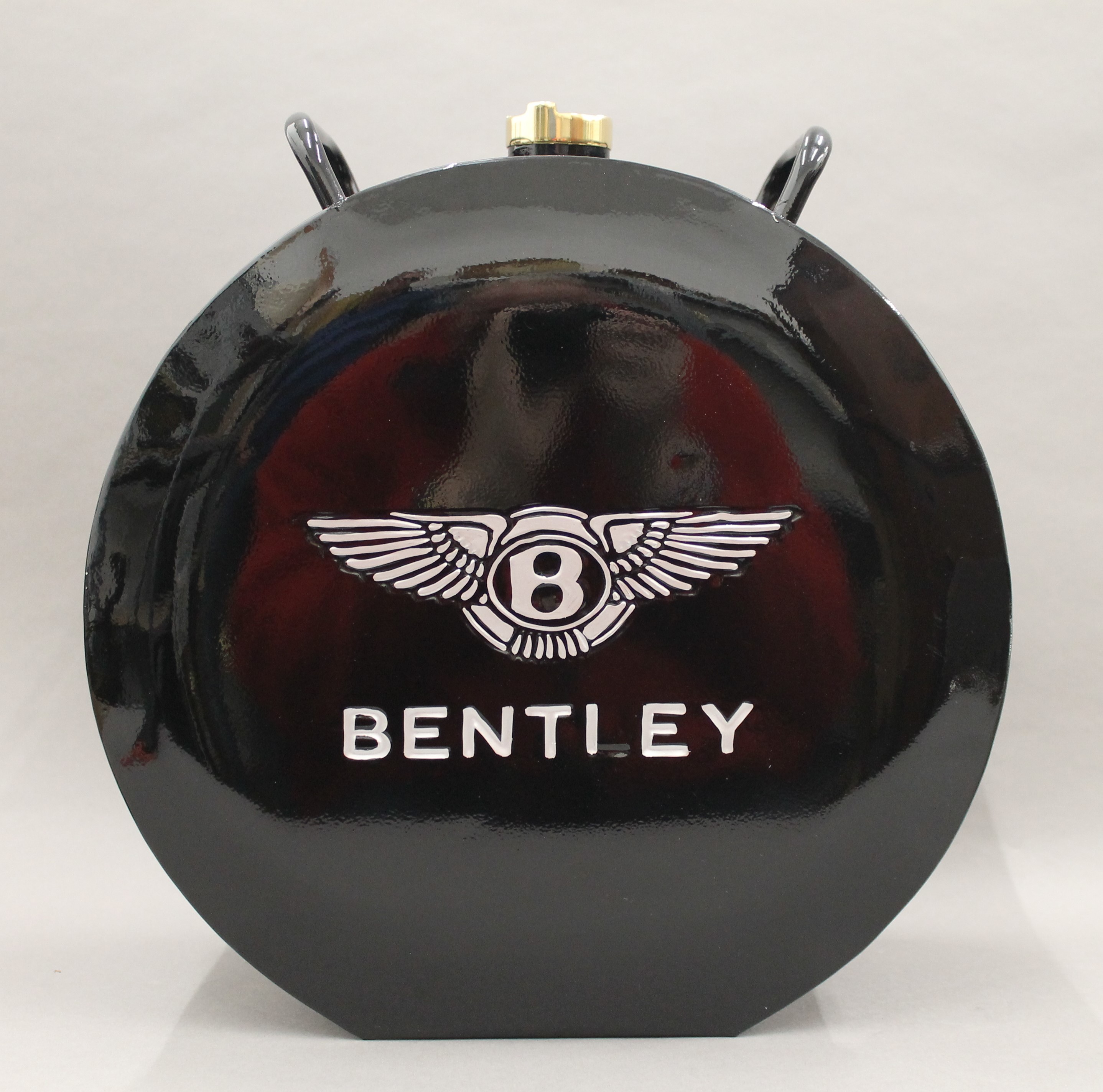 An oil can inscribed Bentley. 37 cm high.