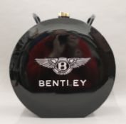 An oil can inscribed Bentley. 37 cm high.