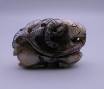 A small jade carving of a goat. 4.25 cm wide.
