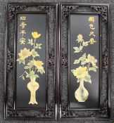 Two large Oriental black lacquered wall hangings with raised decorations. 90.5 cm high.