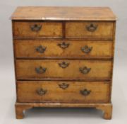 An 18th century walnut chest of drawers. 95 cm wide.