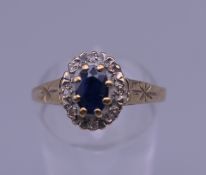 A 9 ct gold sapphire and diamond ring. Ring size R/S.