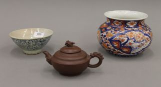 A Chinese provincial bowl, a Yixing teapot and an Imari bowl. The latter 12.5 cm high.