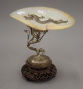 A Chinese silver and mother-of-pearl set tazza mounted on a carved wooden plinth base. 22 cm high.