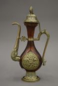 An antique Tibetan copper and white metal ewer,