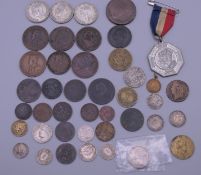 A quantity of coins and medals, including some silver.