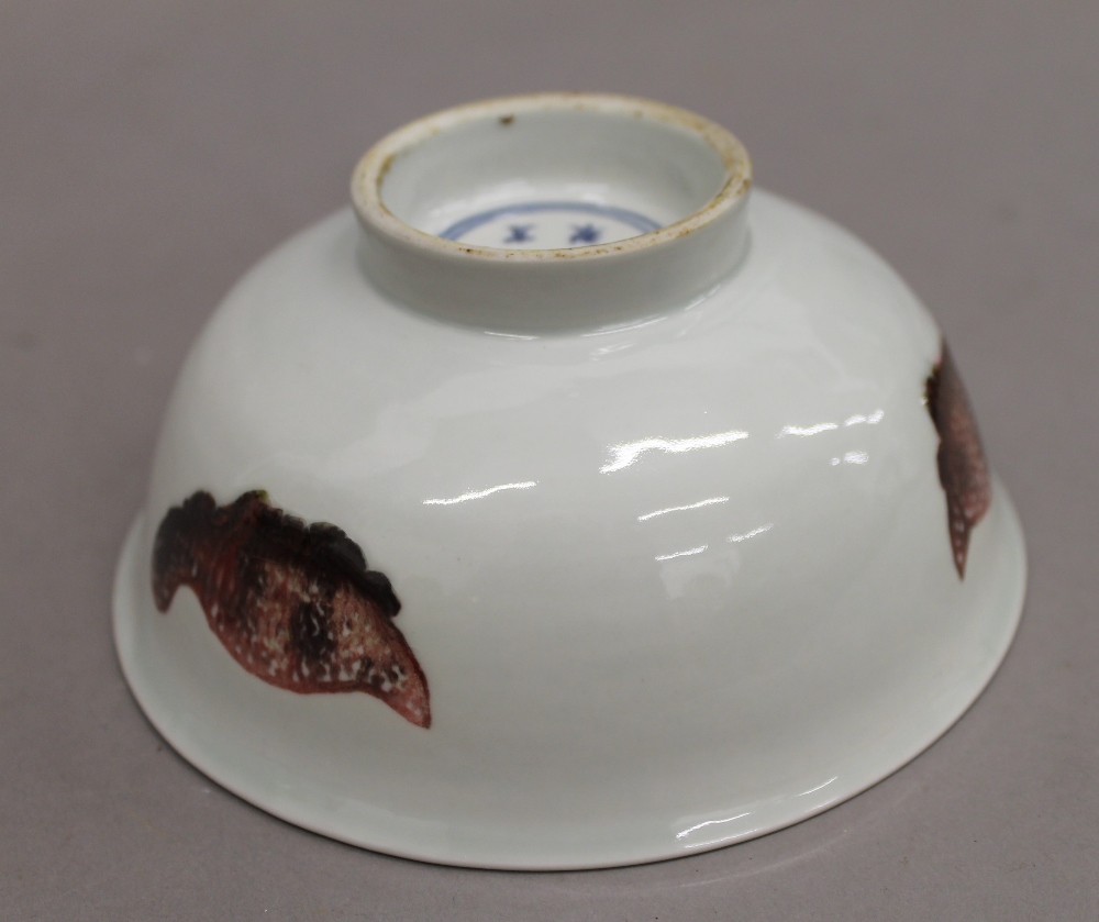 A Chinese porcelain bowl with iron red decoration, the underside with six character mark. - Image 7 of 9