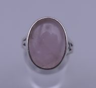 A 1970's silver and rose quartz ring. Ring size N/O.