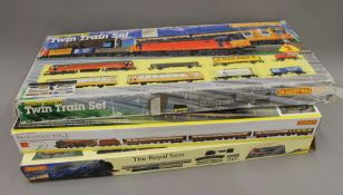 Three boxed Hornby railway sets.