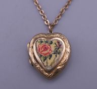 A 9 ct gold back and front locket on a 9 ct gold chain. The chain 4.1 grammes.