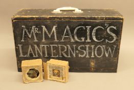 A boxed magic lantern with slides with original gas light burner.