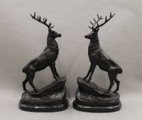 A pair of bronze stags. 43 cm high.