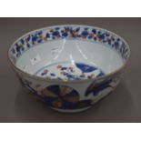 A large 18th century Chinese porcelain underglaze blue and iron red decoration punch bowl,