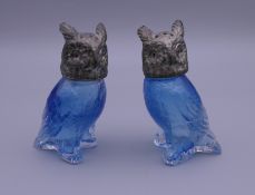 A pair of owl form salt and peppers. Each 8 cm high.