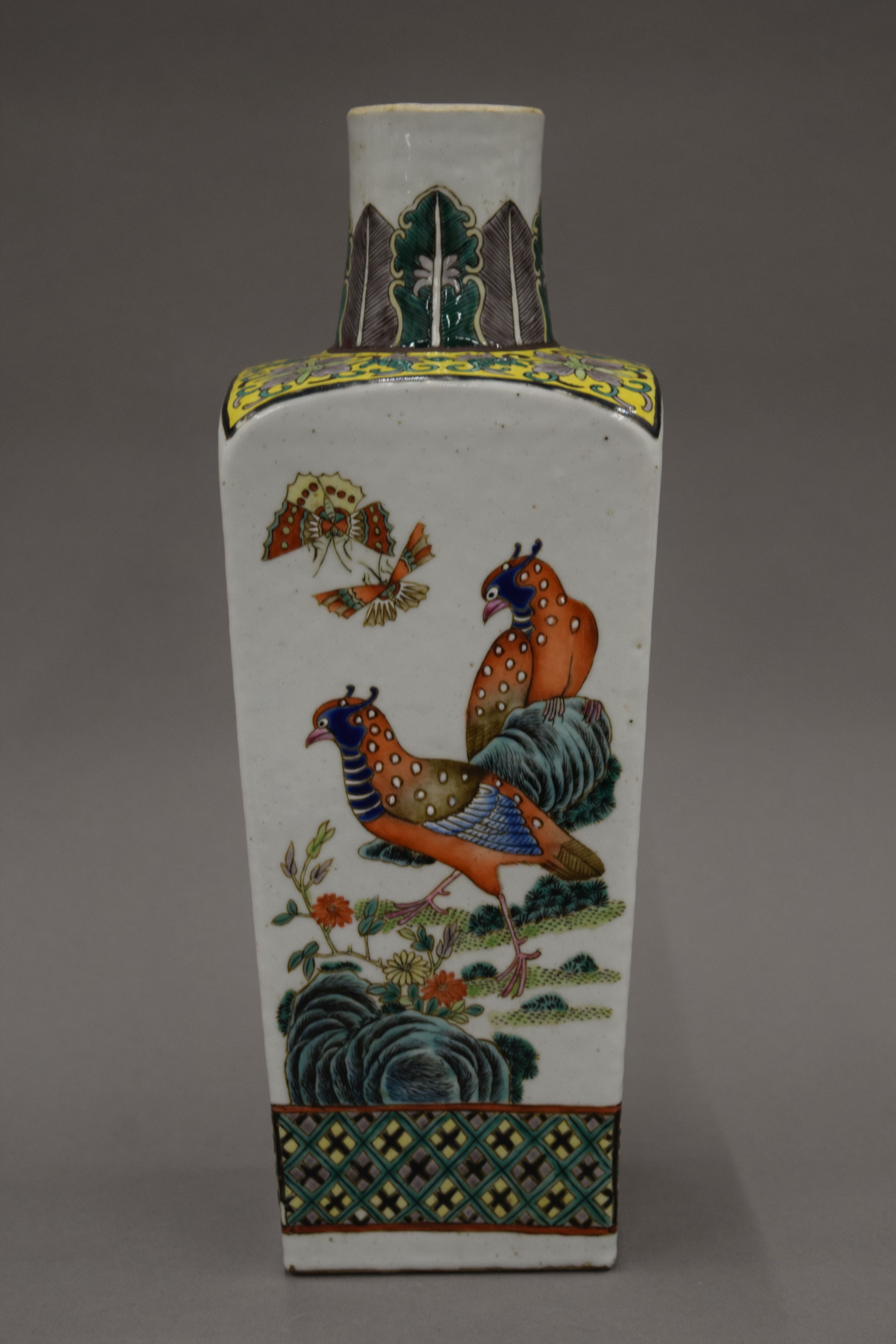 A 19th century Chinese porcelain vase painted with various birds and insects,