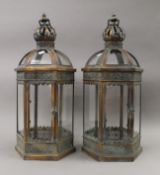 A pair of lanterns. 63 cm high.