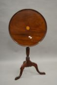 A late 19th century mahogany tripod table. 53.5 cm diameter.