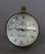 A small ball clock. 6 cm high.